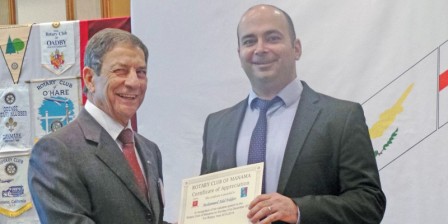 Mr. Fakhro receiving a certificate of thanks from RCM President Hussain Tadayon.