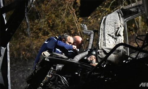 French investigators try to identify coach crash victims