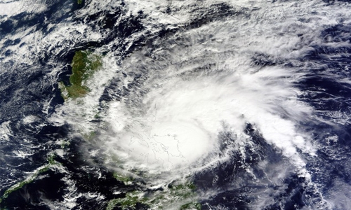 Typhoon kills 4 in Philippines, cuts power ahead of Christmas