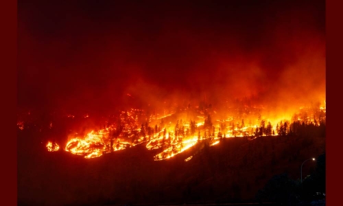 20,000 residents flee Canadian city as wildfires surge