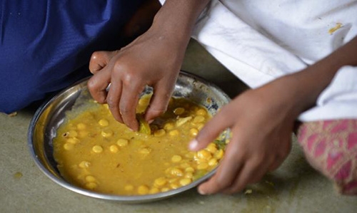 Nearly 100 Indian pupils in hospital after eating school meal