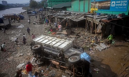 Nepal surveys flood wreckage as death toll reaches 200