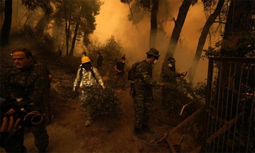 Fire devours Greek island's forests; residents urged to flee