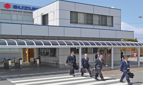 Japan officials raid headquarters of Suzuki over fuel-testing scandal