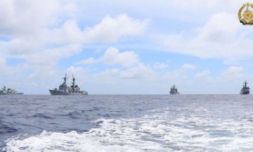 China launches air, sea patrols near flashpoint reef as US holds joint drills