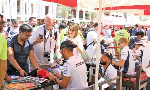 Fans wait hours to meet F1 idols
