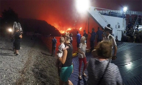 Fires rampage through forests in Greece; thousands evacuated