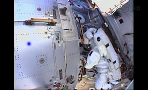 Water in NASA astronaut's helmet cuts short spacewalk