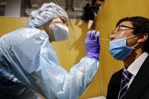 Japan opens airport coronavirus test lab for departing travellers