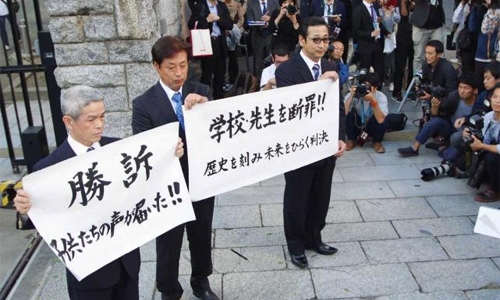 Japan court orders damages for pupils' tsunami deaths